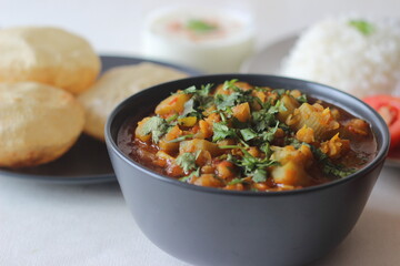 Bottle Gourd Curry with Lentils served with steamed basmati rice and deep fried whole wheat Indian flat brea