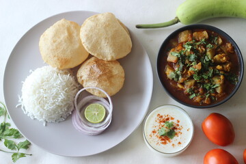 North Indian vegetarian meals. One pot preparation of lentil and bottle gourd served with steamed basmati rice and deep fried whole wheat Indian flat bread.