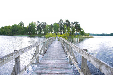 Fototapeta na wymiar A small bridge over the Herrestad`s lake in Värnamo, Sweden