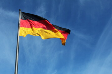 German flag against blue sky