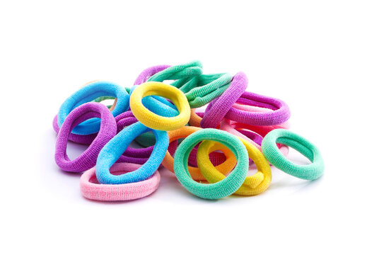 Heap of various hair ties. Multicolored elastics isolated on white background.