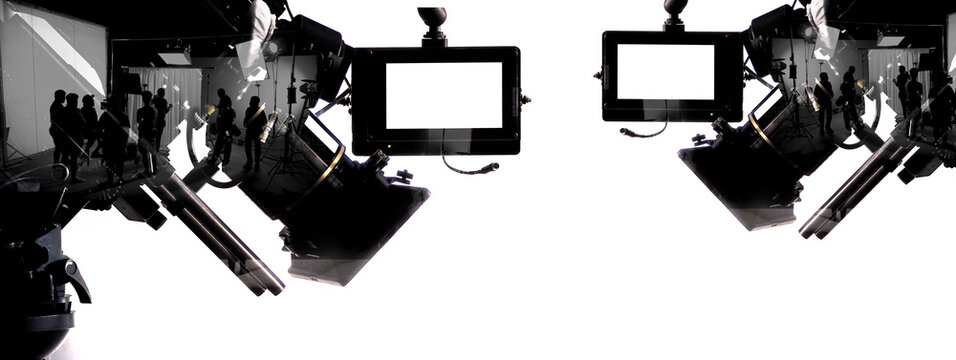 Silhouette images of film production. behind the scenes or b-roll of making video commercial movie. Film crew lightman and cameraman working together with film director in studio. Film industry.