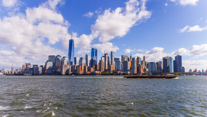 A picture of Manhattan skyline with Battery Park and Maritime terminals, bridges and Brooklyn, NY, USA