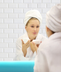 Magic anti-aging cream.Applying the cream..