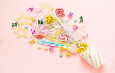 Sweets, sweets, holiday accessories fly out of a paper cup