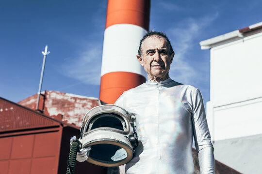 Elderly spaceman standing in spaceport