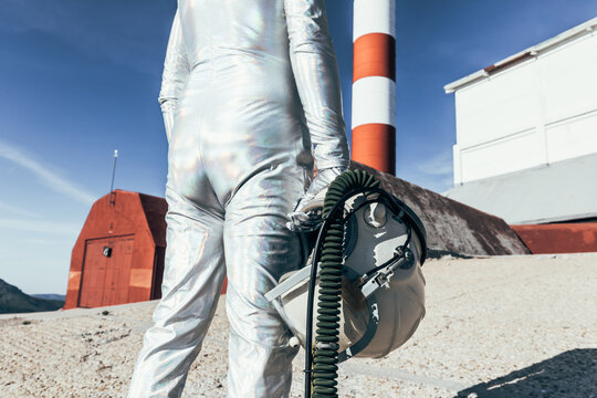 Cosmonaut against rocket shaped antennas
