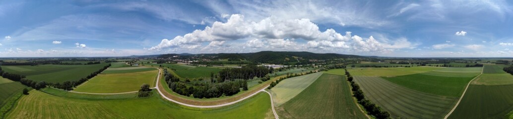 Panorama landscape from the air in the Bavarian Danube area with cloudy summer sky