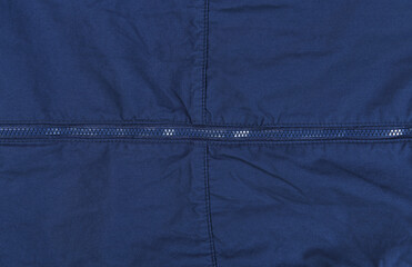 Blue zipper on a blue windbreaker jacket.  © lial88