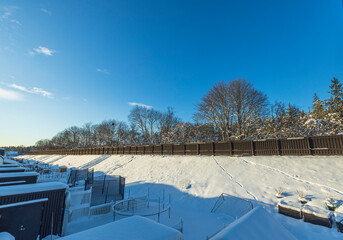 Beautiful landscape view of snowy backyards of townhouses. Winter backgrounds. Sweden. 