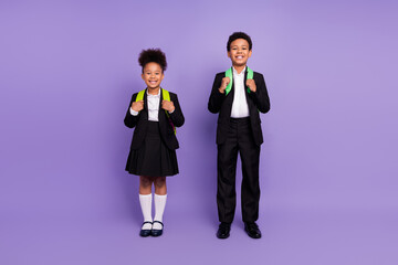 Photo of two african people small schoolkids toothy smile wear backpack uniform isolated violet color background