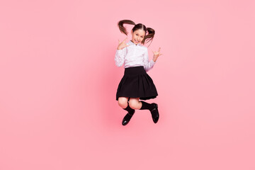 Full body photo of happy positive brunette tails girl jump up wear formalwear uniform show rock sings jump isolated on pink color background