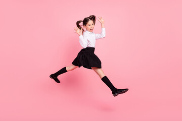 Fototapeta na wymiar Full length photo of crazy happy cheerful girl jump up walk empty space cool isolated on purple color background