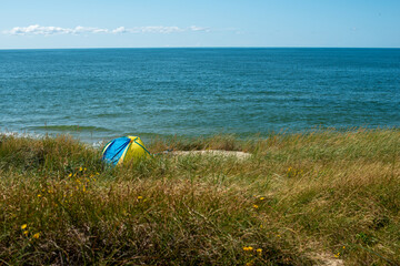 Tent in the dune grass by the Baltic sea, Lithuania.