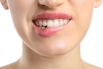 Young woman with beautiful lips on white background, closeup
