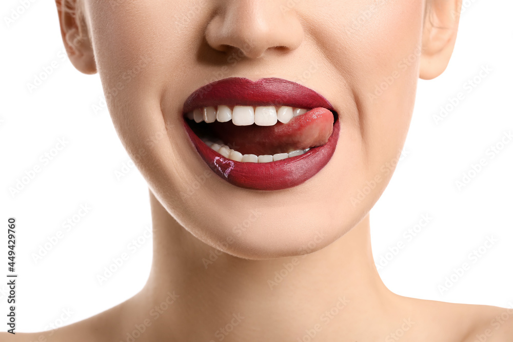 Poster beautiful young woman with heart on lips against white background, closeup