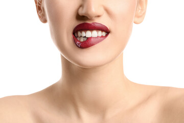 Obraz premium Beautiful young woman with heart on lips against white background, closeup
