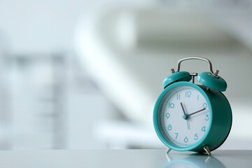 Alarm clock on table in room