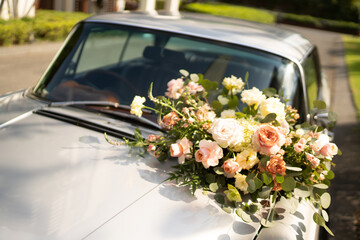 a bouquet flower is on a wedding car