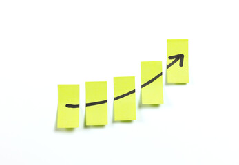 post it notes with growing rising business graph