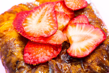 Puff pastry bun or roll. Cake with fresh strawberries. Delicious sweets temptation and desserts on...