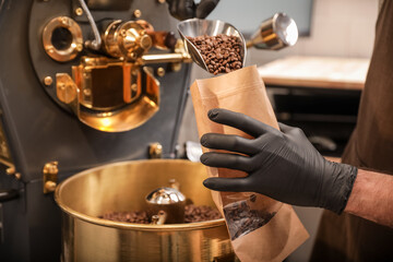 Man packaging coffee beans after roasting