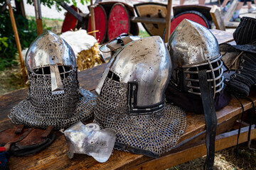 Knight's helmet made of steel on a wooden table.