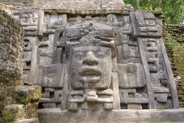 Ancient stone carving at the Mayan ruin of Lamanai, Belize