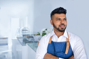 Customer receptionist in front of the restaurant entrance looks smiling