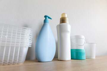 Different types of plastic package in everyday life. Bottles cleaned from labels and prepared for separate collection of garbage. Shot from below, concept of the power and prevalence of the palstic