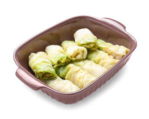 Baking dish with uncooked cabbage rolls on white background