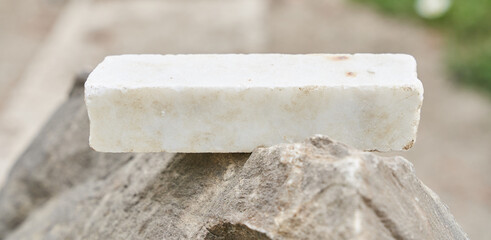 stone podium on a gray rocky background. High quality photo