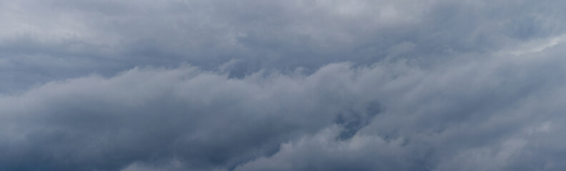 Dramatic sky with thick gray clouds before a thunderstorm