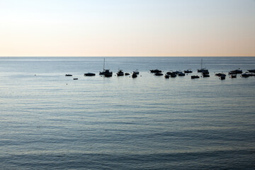 Morning landscape, sunrise over the river, sandy beach near the shore are boats.