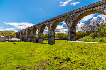 Fototapeta na wymiar A view along the railway viaduct in Cullen, Scotland on a summers day