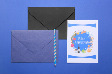 Greeting card for Rosh hashanah (Jewish New Year) with envelopes on color background