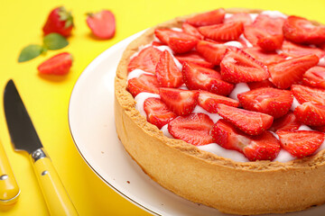 Plate with tasty strawberry pie on color background, closeup