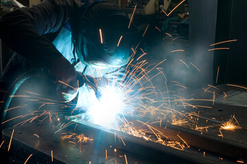 welder at work close up with sparks