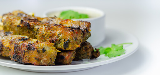 Pork shoulder kebabs with a lemon and herb rub and a garlic and mint yogurt sauce