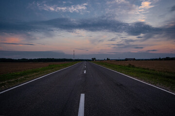 Road in the village in the evening in summer