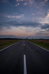Road in the village in the evening in summer