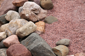 Boulders, huge stones, decorative design next to small stones