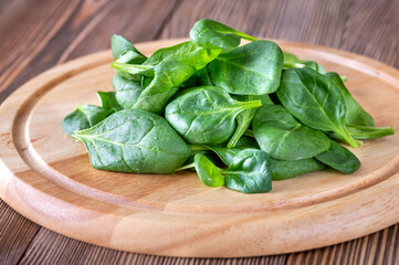 Fresh spinach on the wooden board