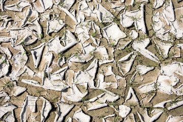 Dry  cracked chalk texture in the process of drought and lack of rain or moisture. Hydrological drought, ecological catastrophe