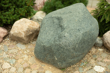 Stone in the garden. Cobblestone in the park.