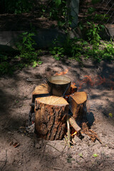 Boiling water on a swedish torch during survival trip