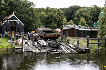 Fototapeta na wymiar Antique boat wharf in Open Air Museum Arnhem (NL)