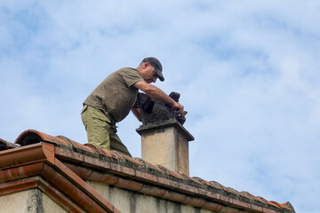 Roof work to clean the chimney. - 449443338