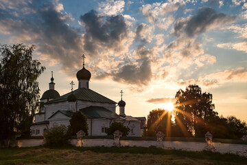 Church of Elijah the Prophet (Ilinskaya), 17th century, in the last rays of the setting sun. Gold ring of Russia. Kostroma region, Kostroma, Russia.