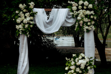 very beautiful wedding arch of the newlyweds in nature